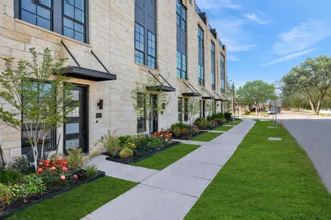 a view of a building with a yard