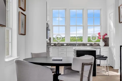 a kitchen with a table and chairs