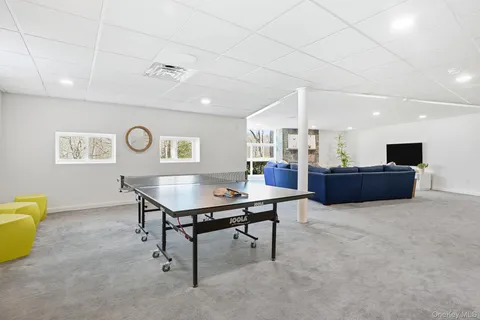 a room with furniture and a table with wooden floor