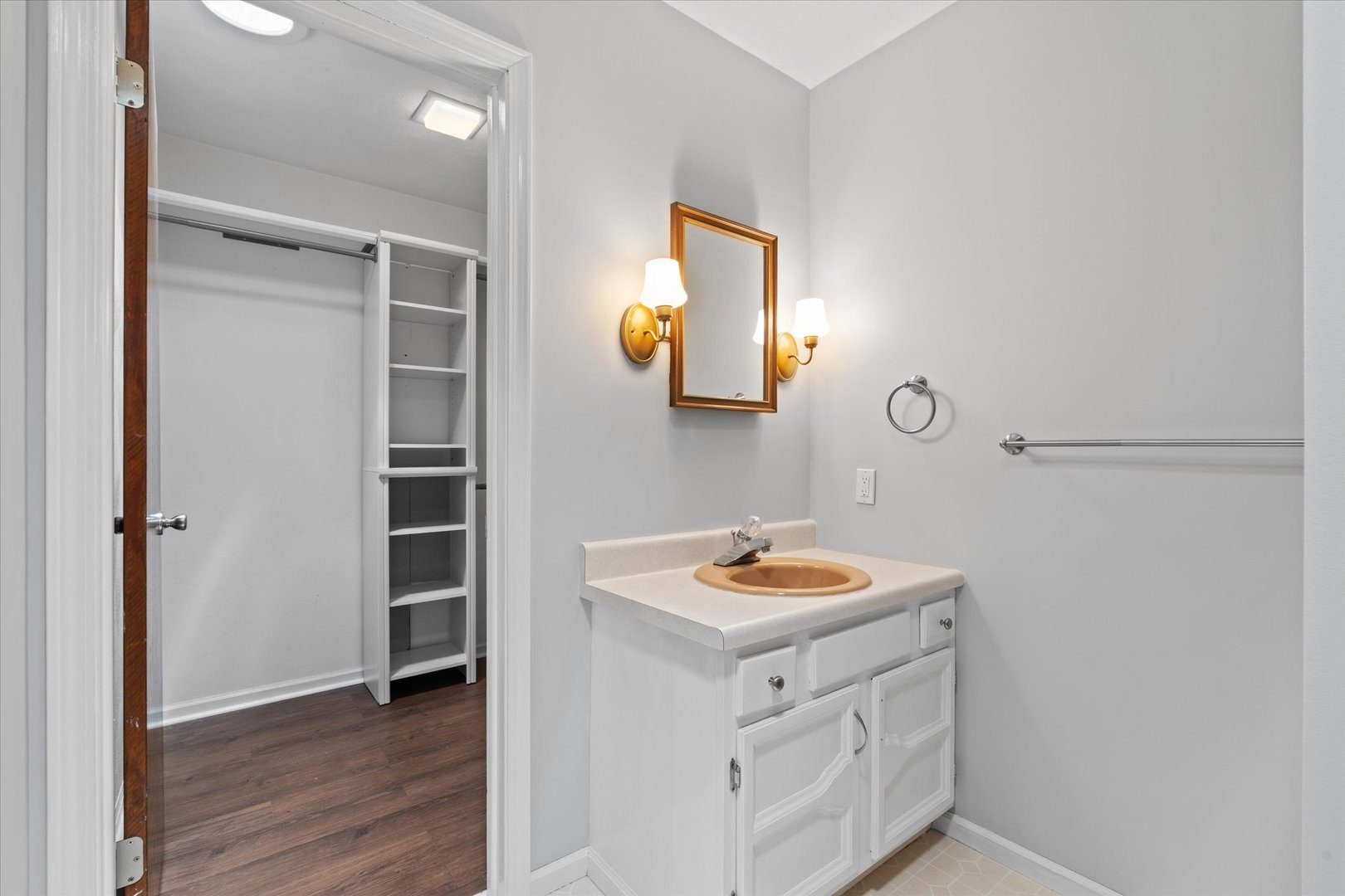 10 Oak Grove Road Geneseo, IL 61254 - Photo 25 of 43 a bathroom with a sink mirror and vanity