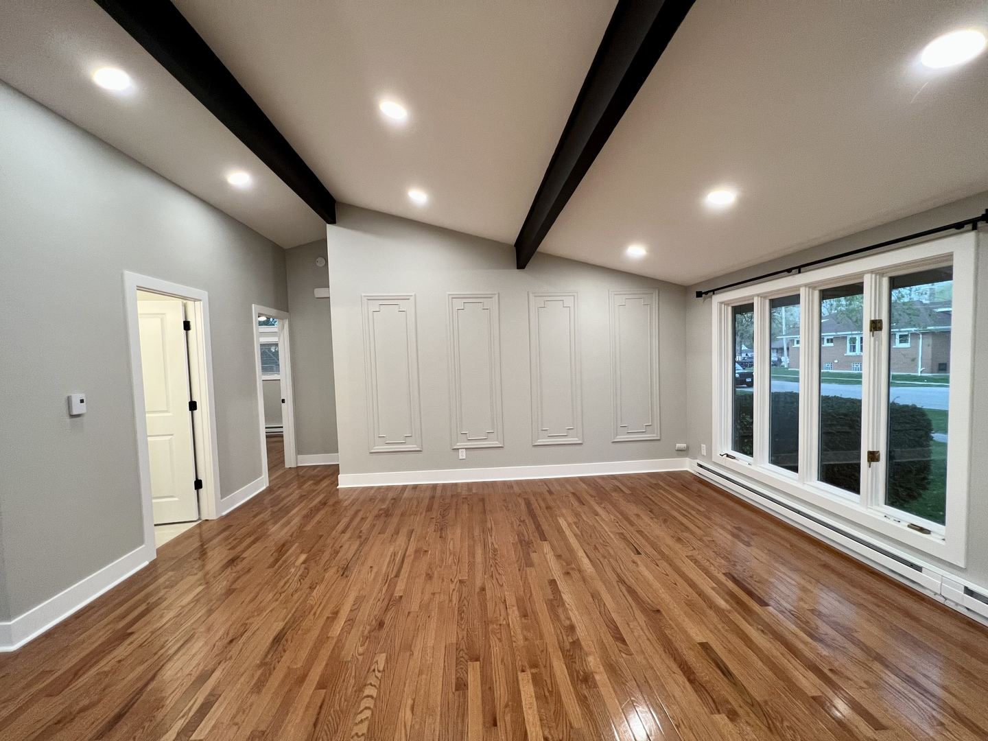 515 South Street Lockport, IL 60441 - Photo 11 of 22 a view of an empty room with wooden floor and windows