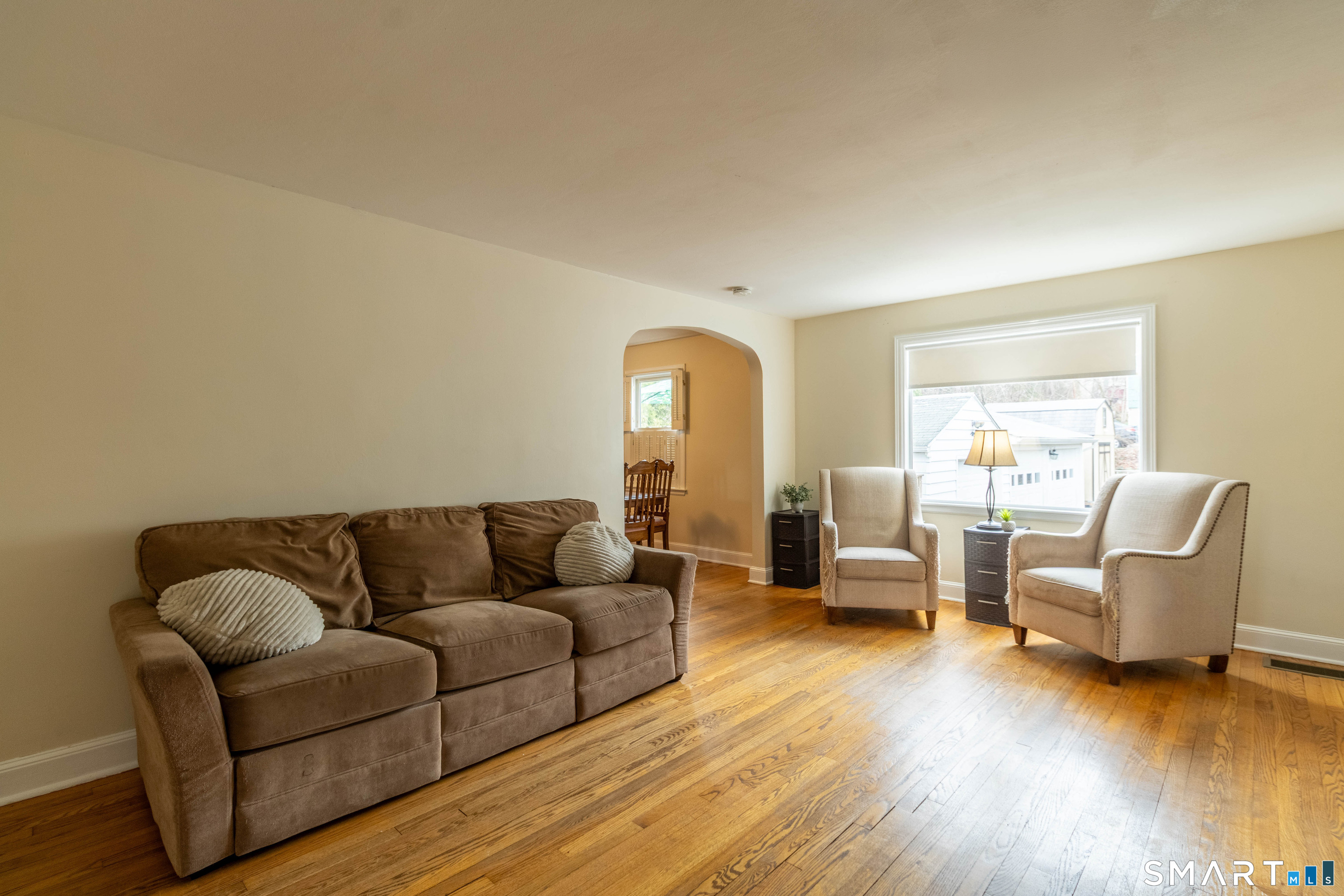 535 Lower Lane Berlin, CT 06037 - Photo 13 of 40 a living room with furniture and a wooden floor
