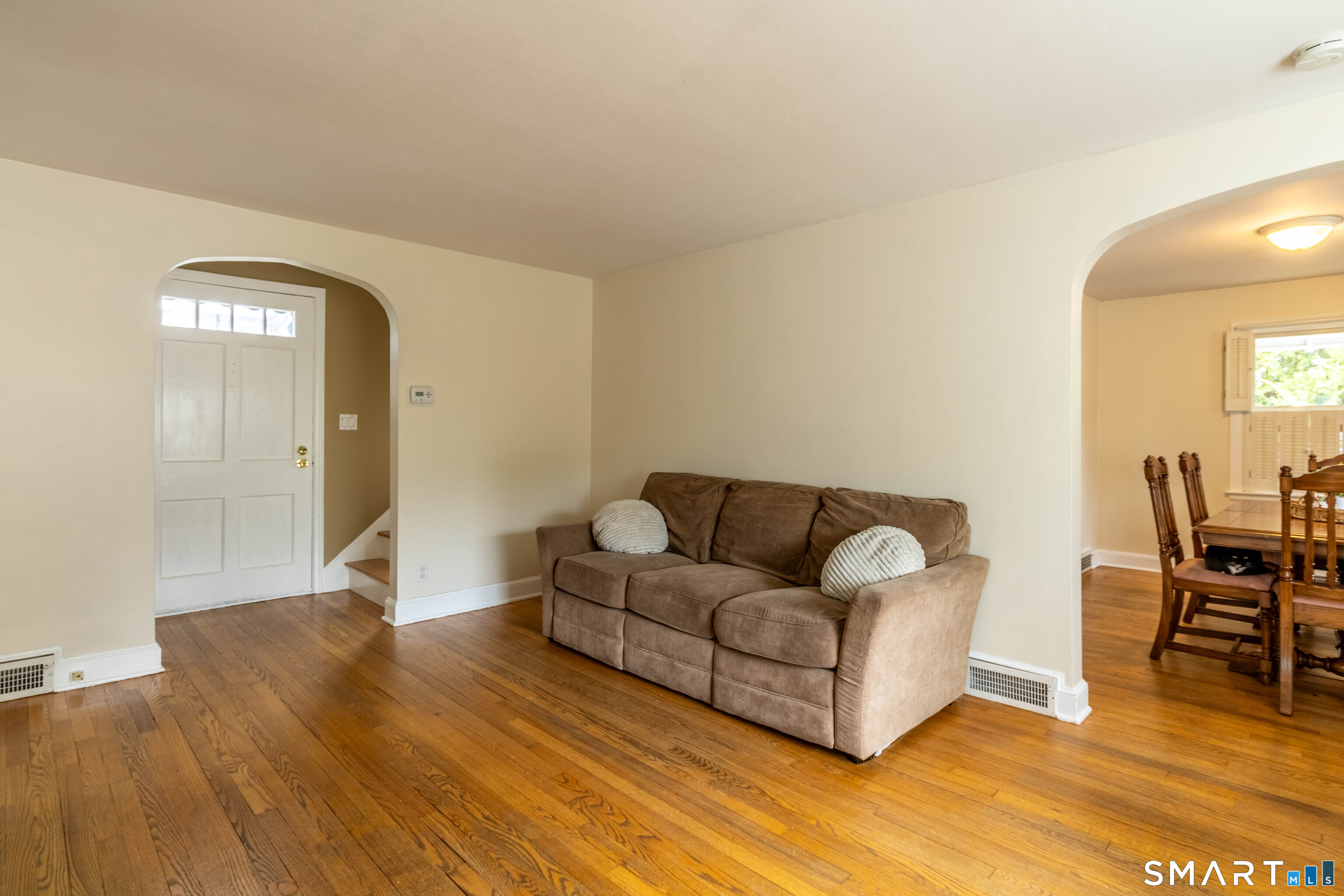 535 Lower Lane Berlin, CT 06037 - Photo 14 of 40 a living room with furniture and a wooden floor