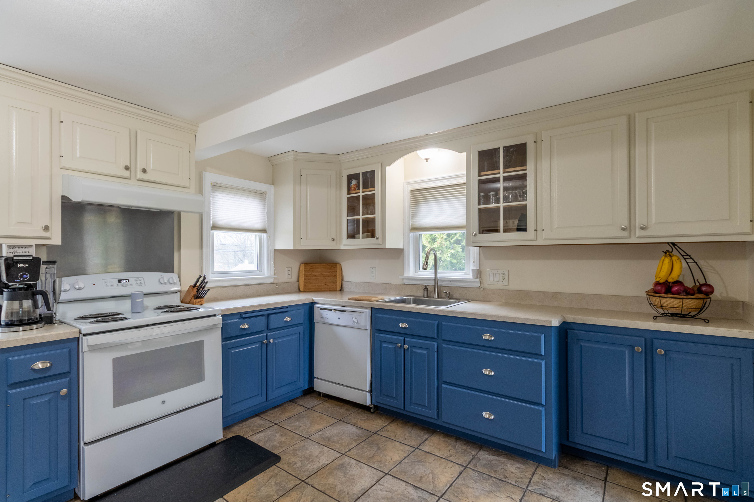 535 Lower Lane Berlin, CT 06037 - Photo 19 of 40 a kitchen with stainless steel appliances granite countertop a sink and cabinets