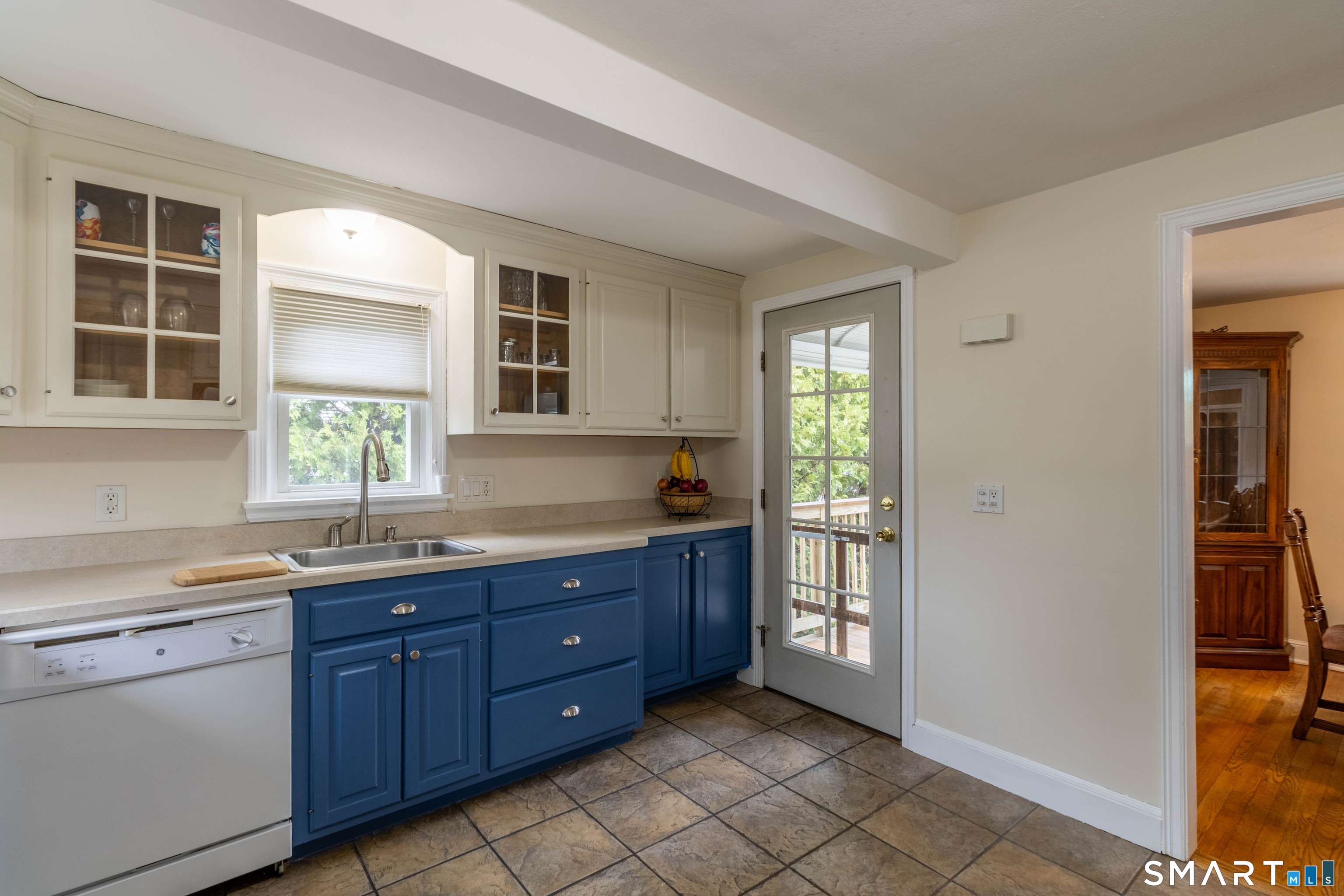 535 Lower Lane Berlin, CT 06037 - Photo 20 of 40 a kitchen with a sink window and cabinets