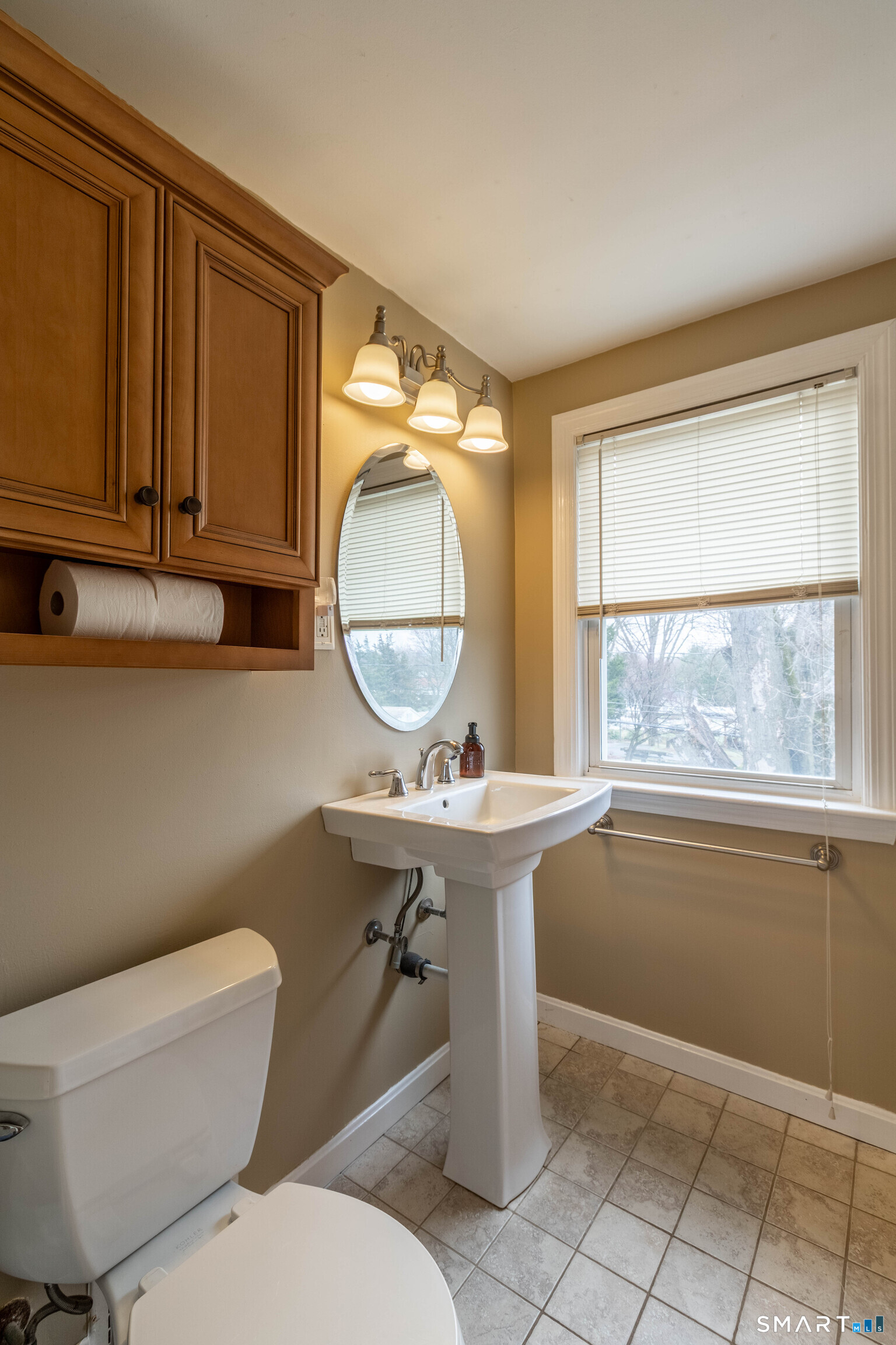 535 Lower Lane Berlin, CT 06037 - Photo 21 of 40 a bathroom with a toilet a sink and a mirror