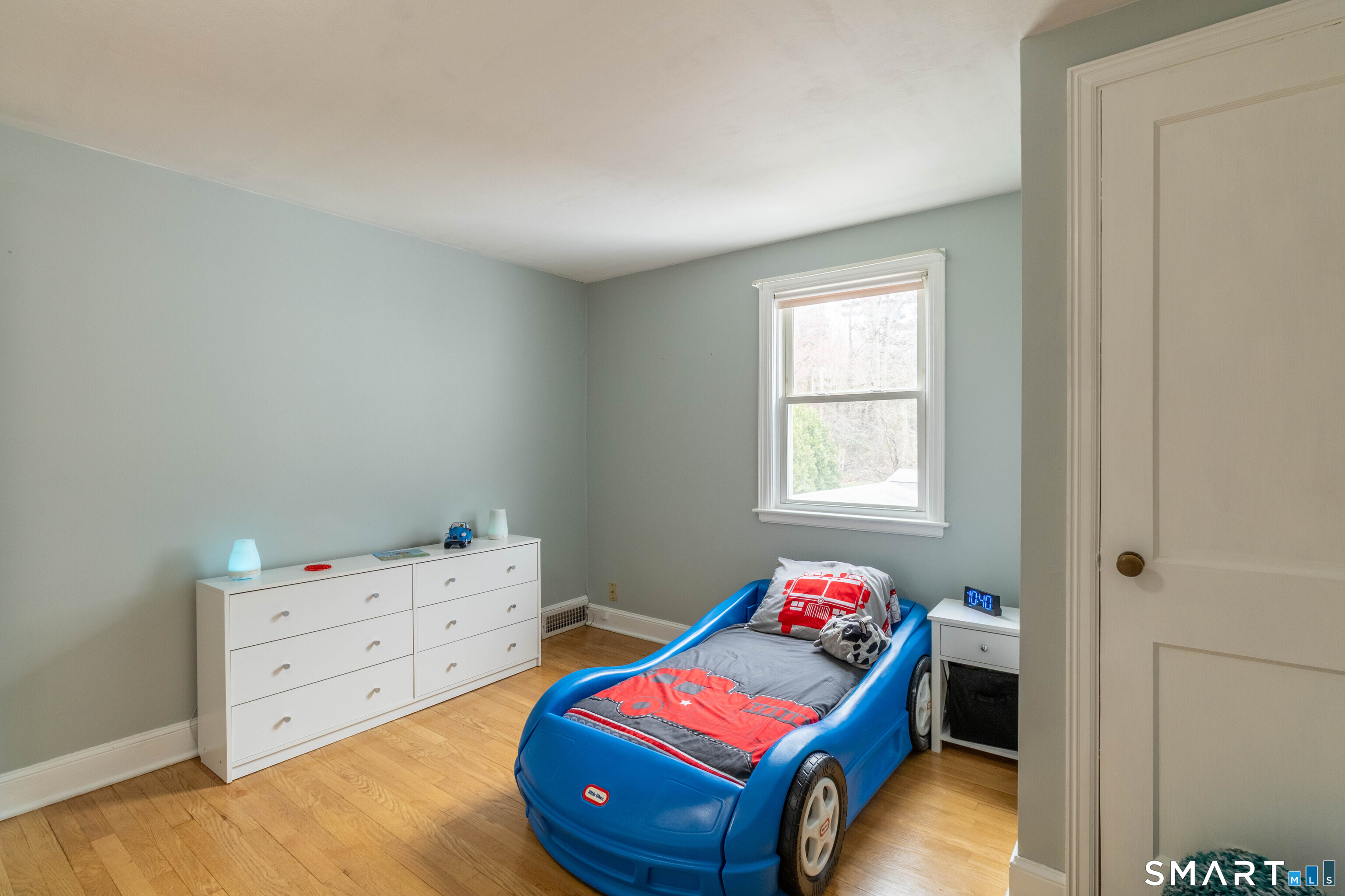 535 Lower Lane Berlin, CT 06037 - Photo 25 of 40 a bedroom with baby bed and window