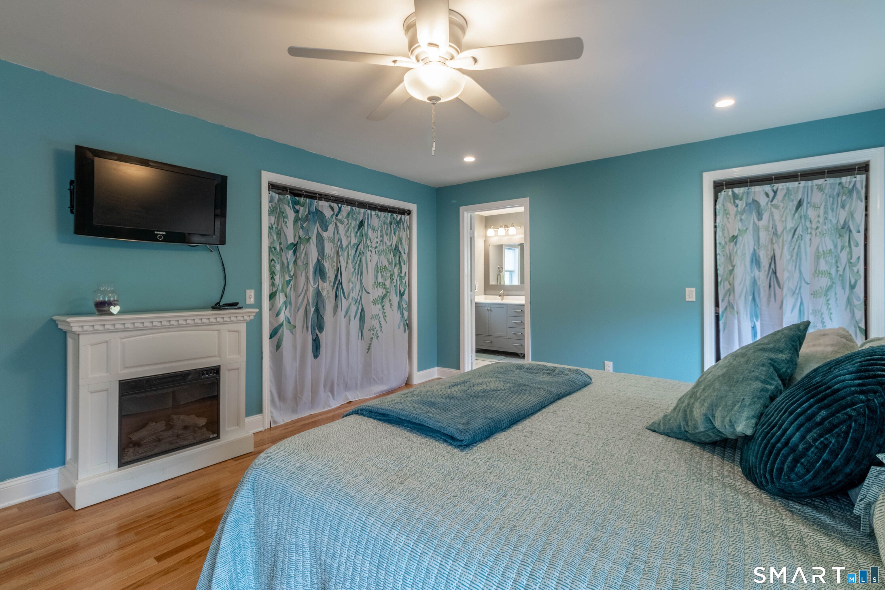 535 Lower Lane Berlin, CT 06037 - Photo 31 of 40 a bedroom with a bed and a flat screen tv