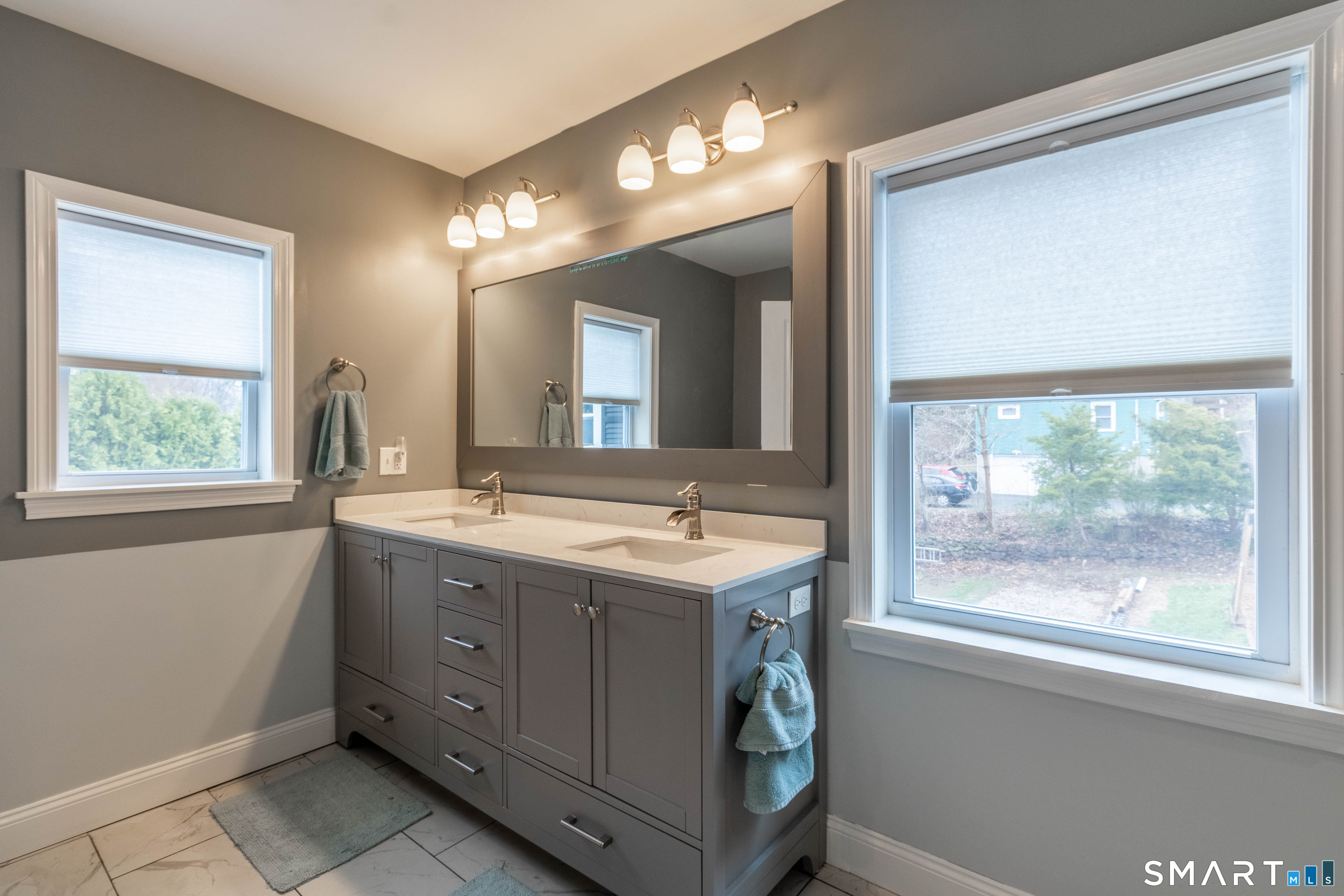 535 Lower Lane Berlin, CT 06037 - Photo 33 of 40 a bathroom with a sink and a mirror