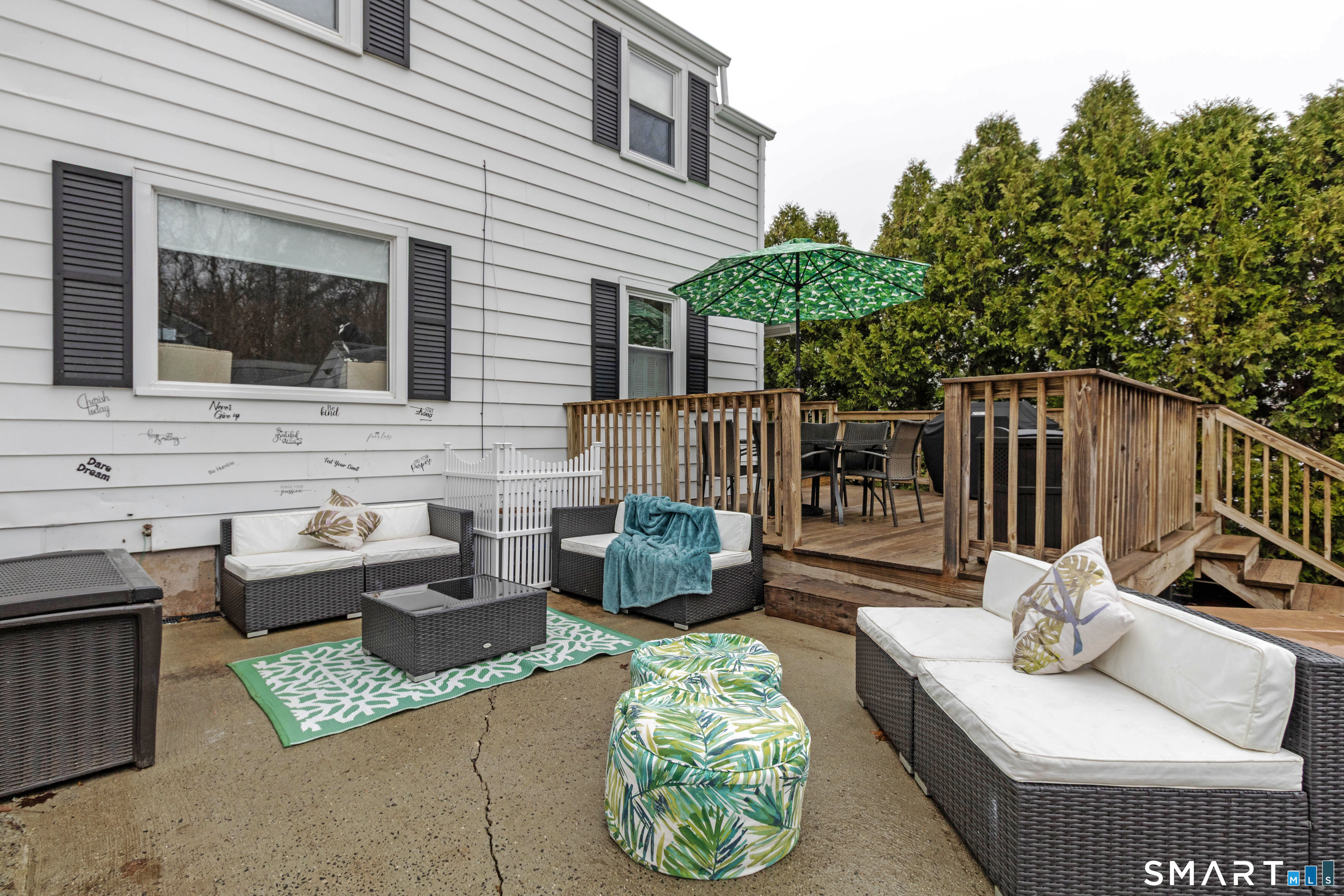 535 Lower Lane Berlin, CT 06037 - Photo 34 of 40 a view of a patio with couches table and chairs and potted plants