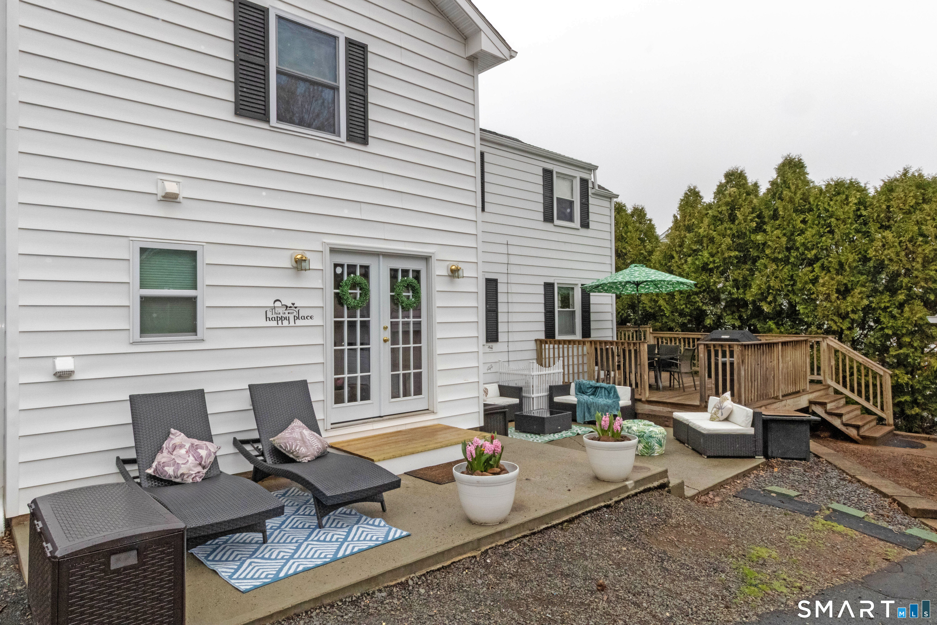 535 Lower Lane Berlin, CT 06037 - Photo 35 of 40 a view of a patio with couches table and chairs and potted plants