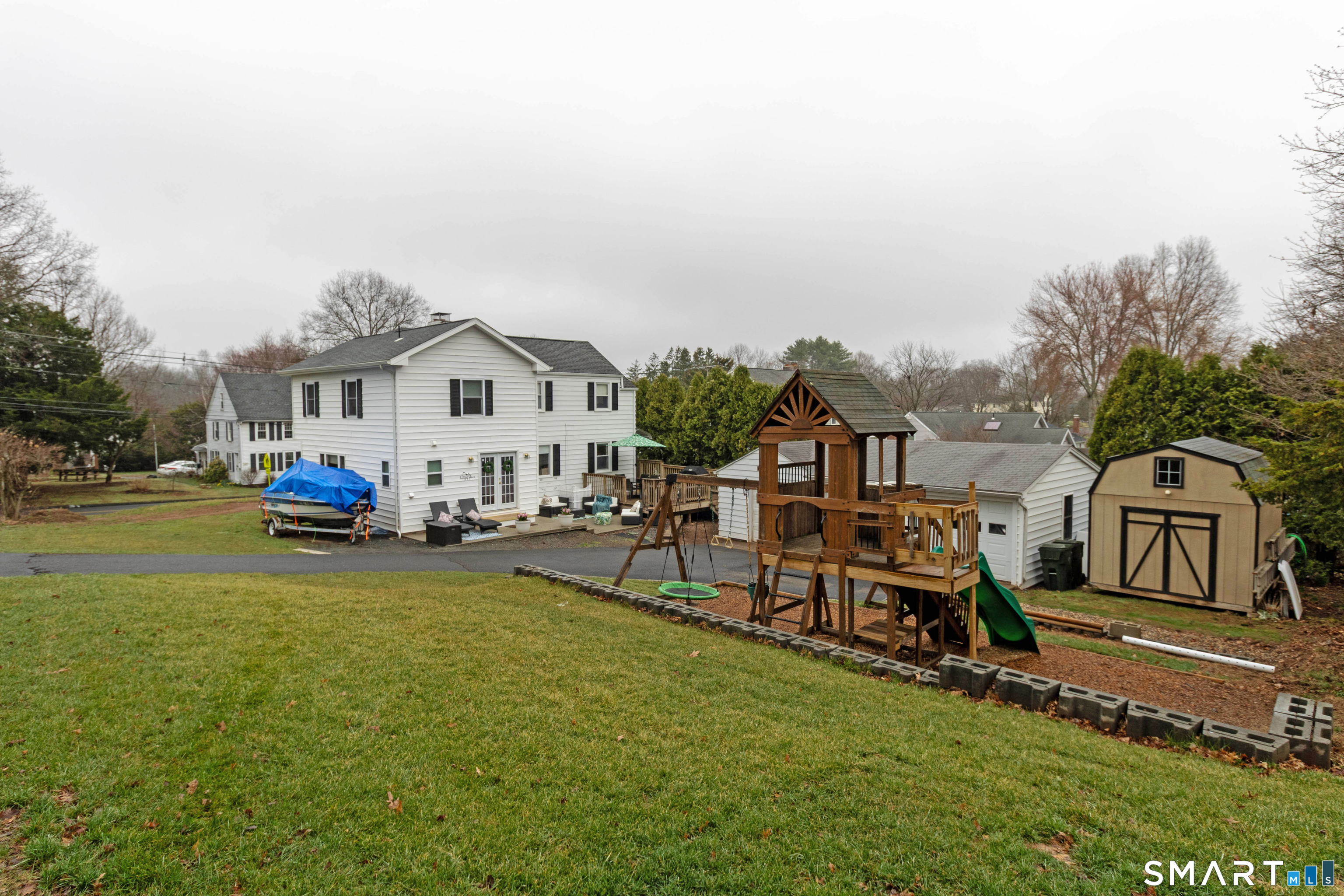 535 Lower Lane Berlin, CT 06037 - Photo 39 of 40 a view of a house with a big yard and large trees