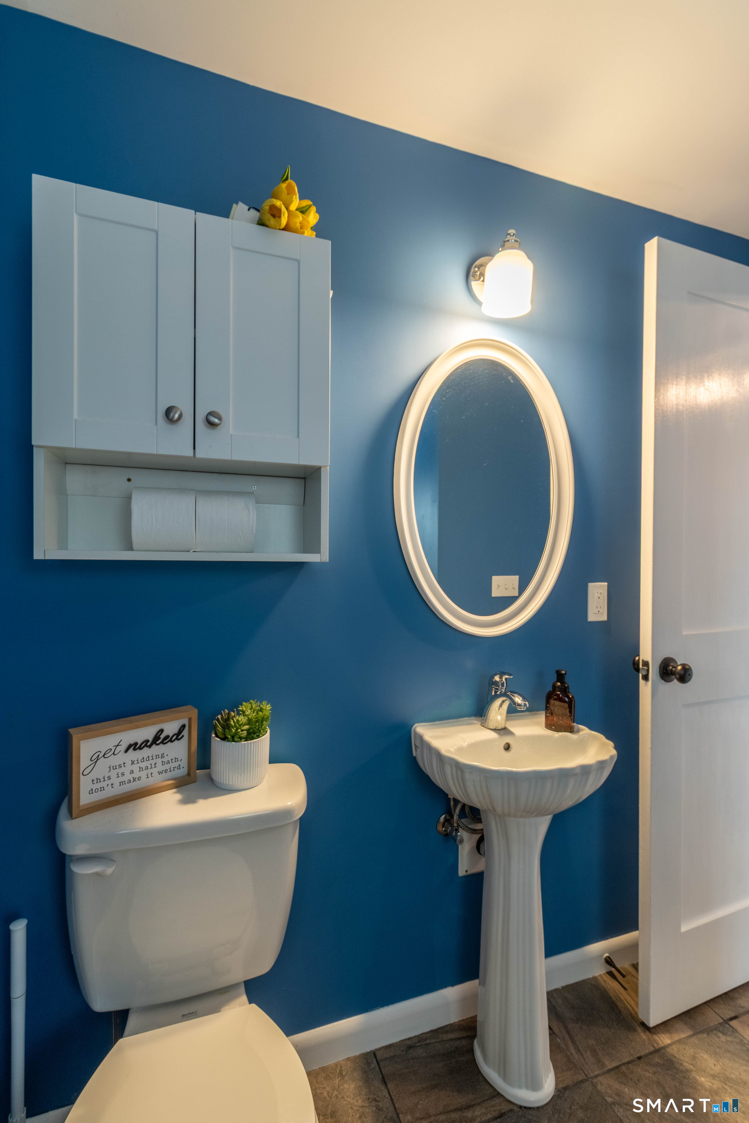 535 Lower Lane Berlin, CT 06037 - Photo 5 of 40 a bathroom with a toilet sink and mirror
