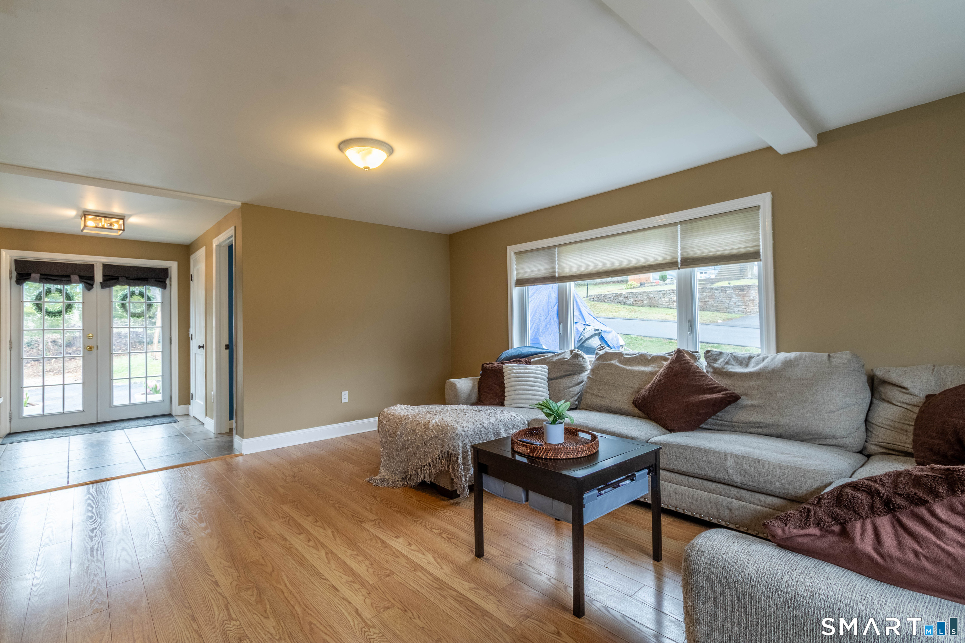 535 Lower Lane Berlin, CT 06037 - Photo 8 of 40 a living room with furniture and a window