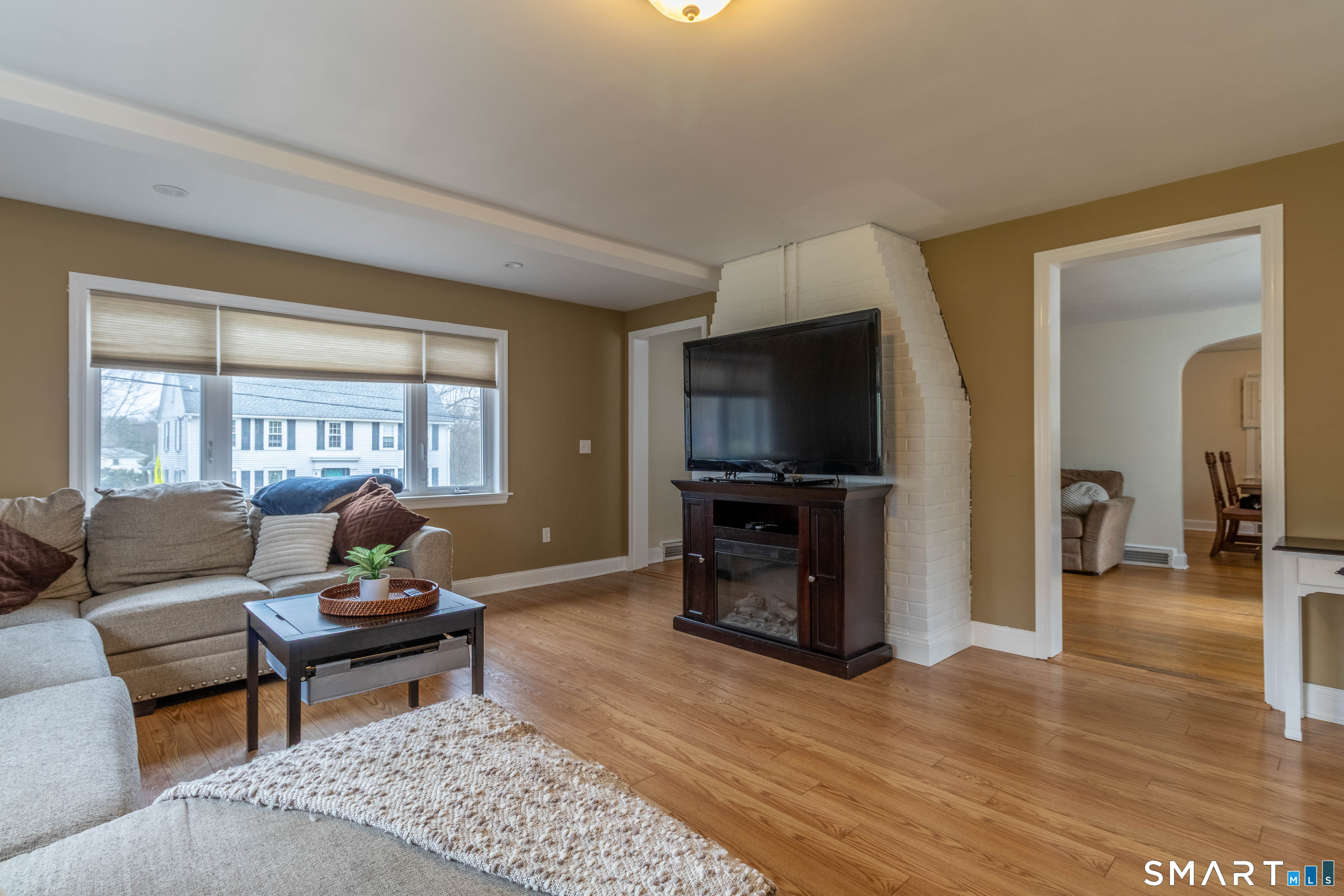 535 Lower Lane Berlin, CT 06037 - Photo 9 of 40 a living room with furniture and a flat screen tv