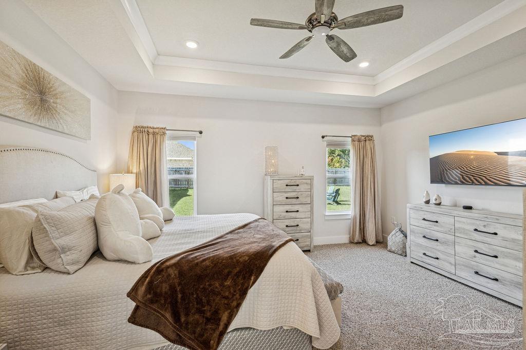 5659 Blake Lane Pace, FL 32571 - Photo 12 of 38 a bedroom with a bed and dresser