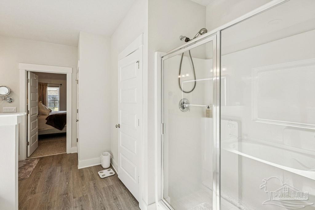 5659 Blake Lane Pace, FL 32571 - Photo 13 of 38 a bathroom with a glass shower door