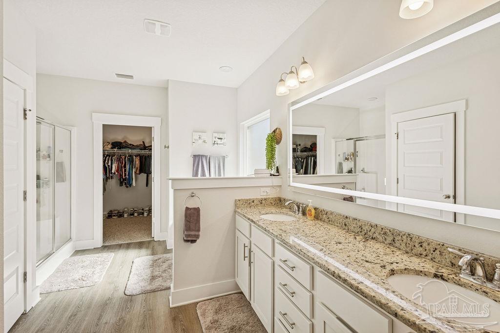 5659 Blake Lane Pace, FL 32571 - Photo 14 of 38 a bathroom with a granite countertop double vanity sink and mirror