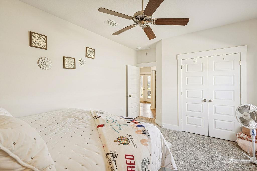 5659 Blake Lane Pace, FL 32571 - Photo 16 of 38 a bedroom with a bed and a window
