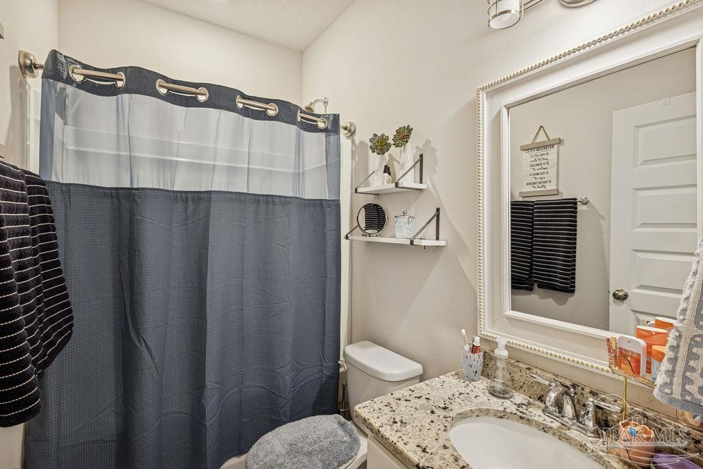 5659 Blake Lane Pace, FL 32571 - Photo 22 of 38 a bathroom with a sink and a mirror