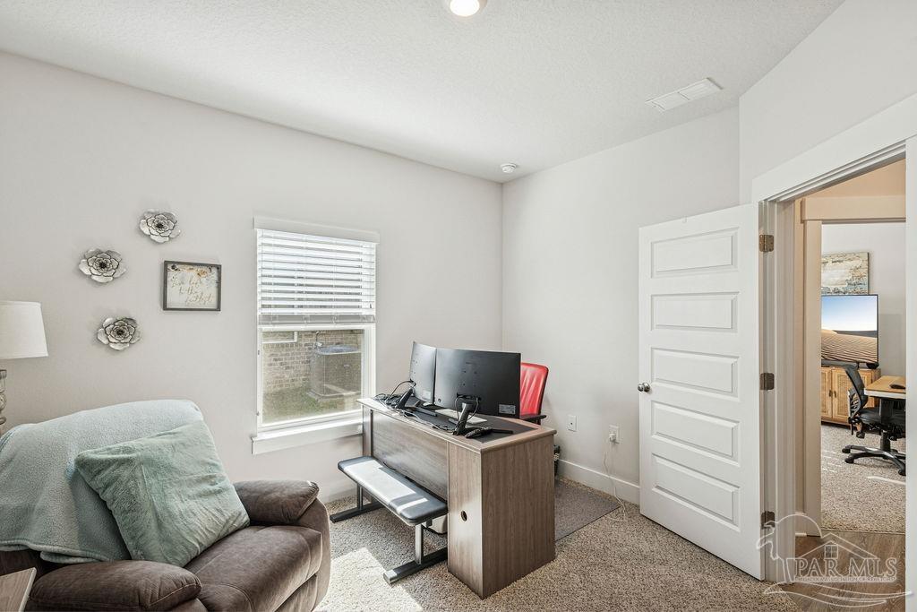 5659 Blake Lane Pace, FL 32571 - Photo 23 of 38 a living room with furniture and a window