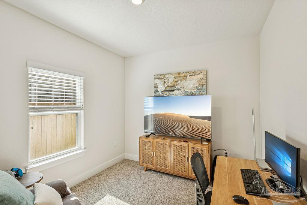 5659 Blake Lane Pace, FL 32571 - Photo 26 of 38 a living room with furniture and a window