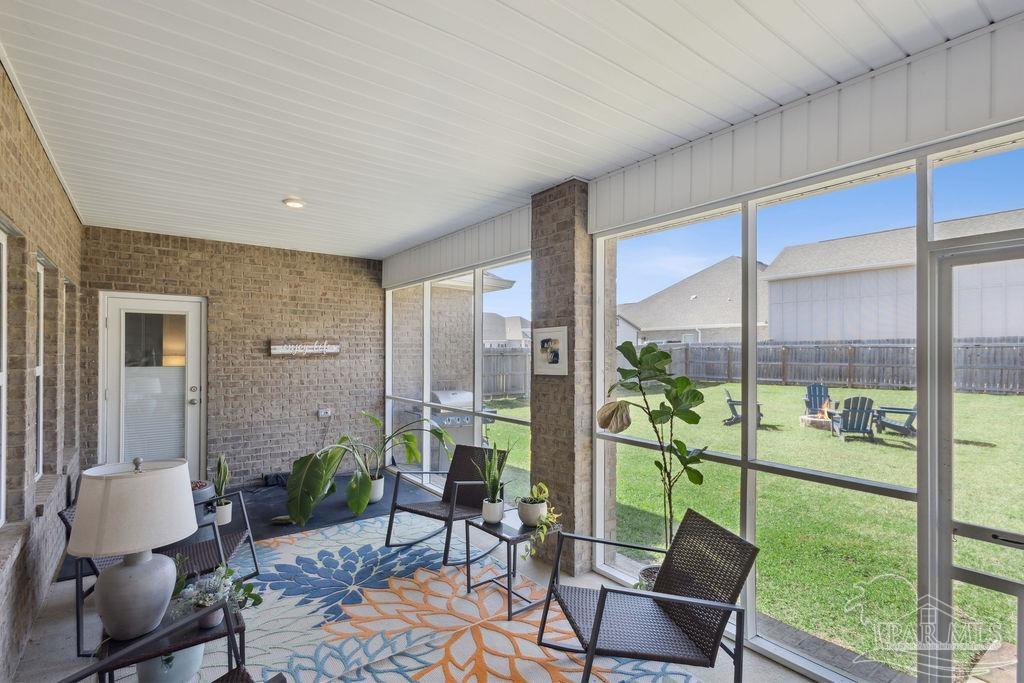 5659 Blake Lane Pace, FL 32571 - Photo 29 of 38 a living room with furniture and a garden