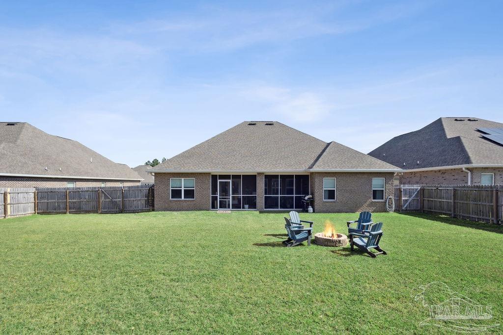 5659 Blake Lane Pace, FL 32571 - Photo 34 of 38 a view of a house with a yard and sitting area