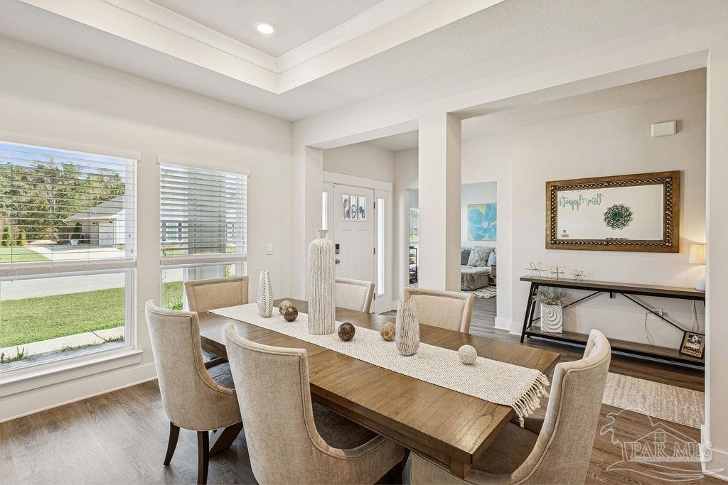 5659 Blake Lane Pace, FL 32571 - Photo 4 of 38 a view of a dining room with furniture window and wooden floor
