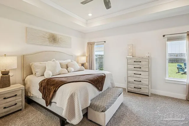 a bedroom with a bed and a dresser