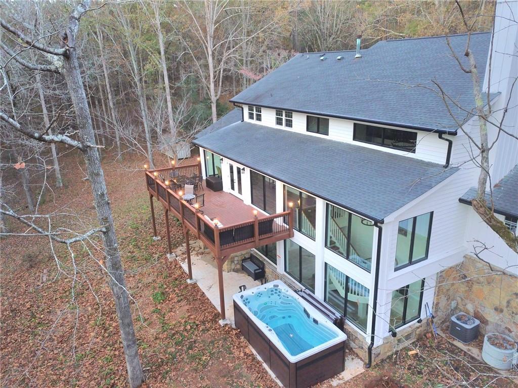 2900 Orchard Road Southwest Conyers, GA 30094 - Photo 3 of 63 a aerial view of a house with a yard and roof deck