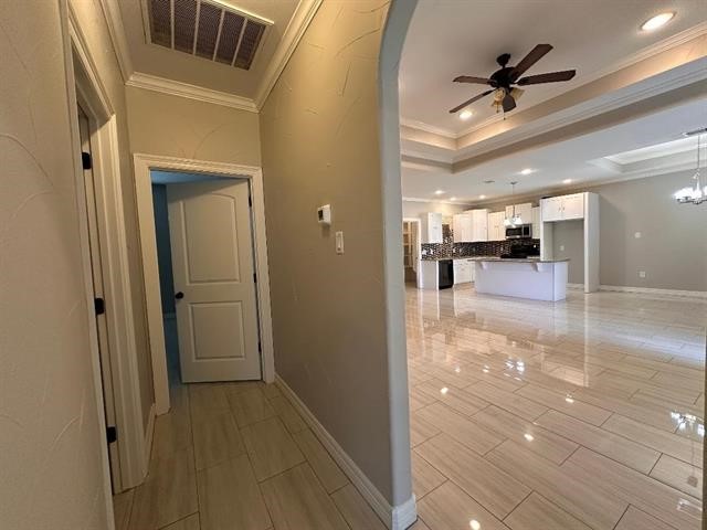 6385 Highpoint Avenue Beaumont, TX 77713 - Photo 11 of 20 a view of a hallway view with wooden floor and dining room
