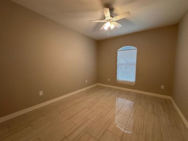 6385 Highpoint Avenue Beaumont, TX 77713 - Photo 12 of 20 wooden floor in an empty room with a window