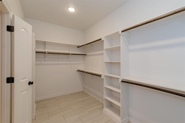 6385 Highpoint Avenue Beaumont, TX 77713 - Photo 15 of 20 a view of an empty walk in closet