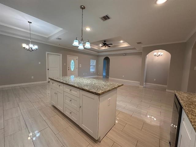 6385 Highpoint Avenue Beaumont, TX 77713 - Photo 5 of 20 a view of a kitchen with a sink and chandelier