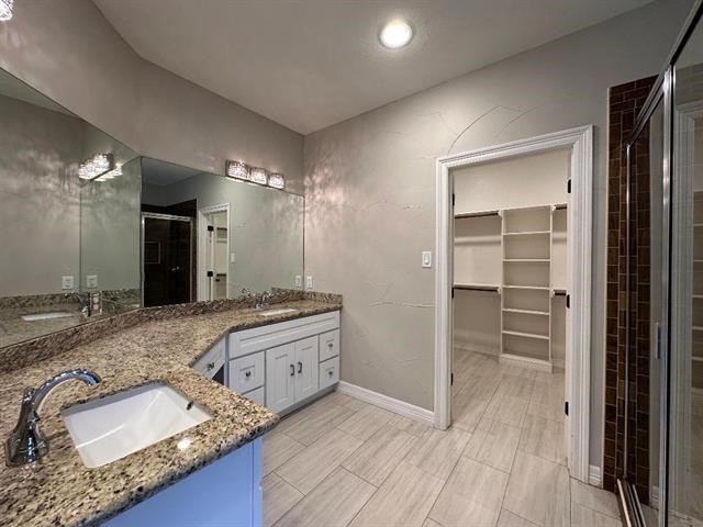6385 Highpoint Avenue Beaumont, TX 77713 - Photo 6 of 20 a bathroom with a granite countertop sink mirror and vanity