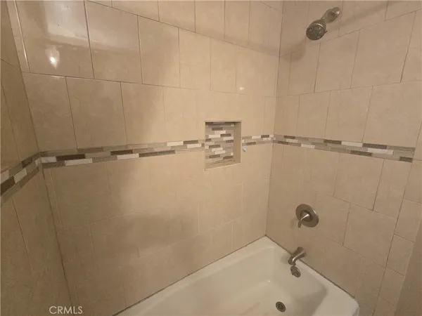 a bathroom with a shower and a bathtub
