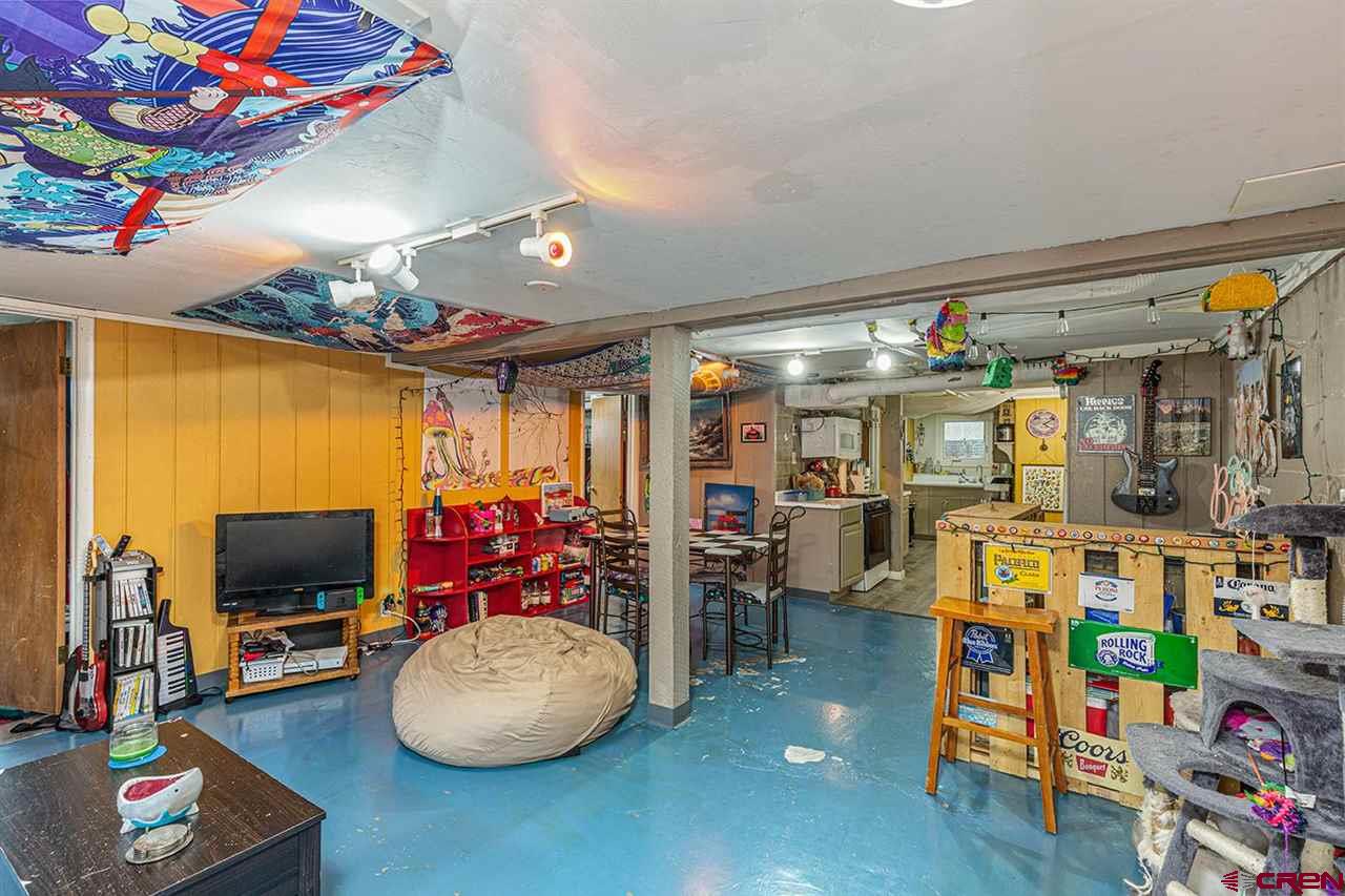 3575 Main Avenue Durango, CO 81301 - Photo 12 of 32 a room with toys and a flat screen tv