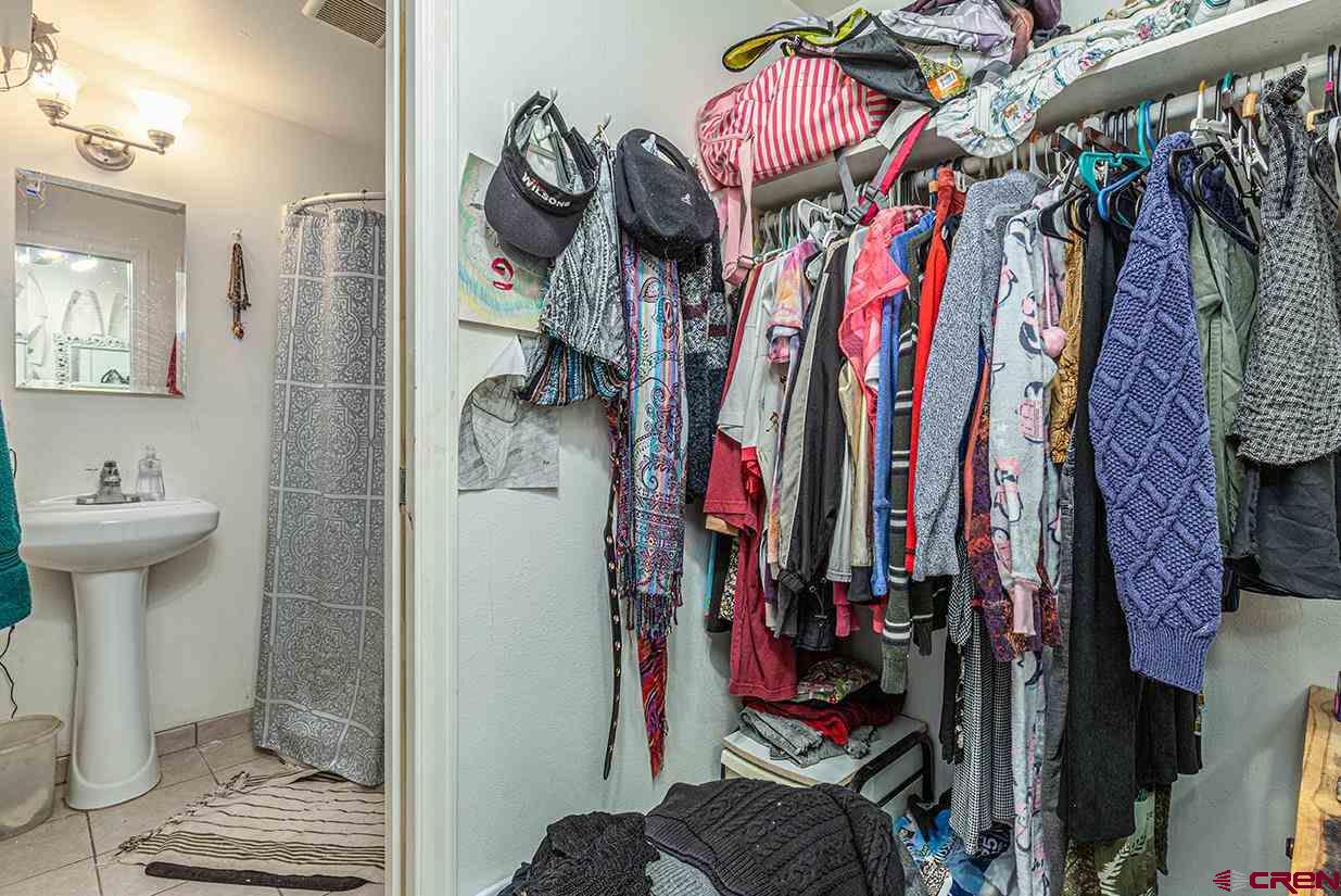 3575 Main Avenue Durango, CO 81301 - Photo 20 of 32 a view of walk in closet with clothes and shoes