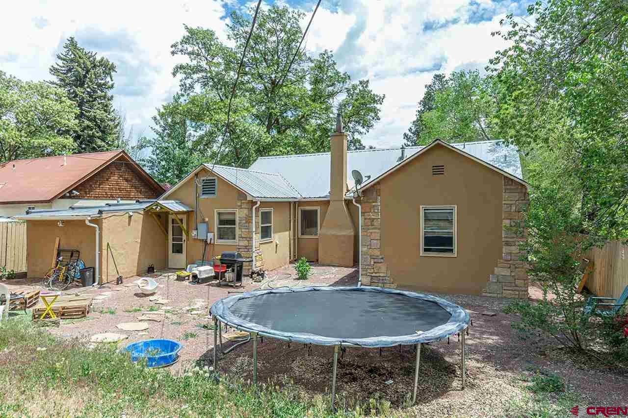 3575 Main Avenue Durango, CO 81301 - Photo 26 of 32 a backyard of a house with table and chairs