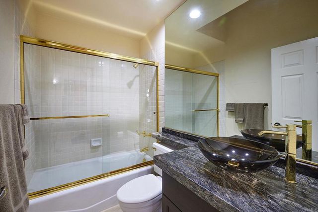 a house that has a tree in front of it