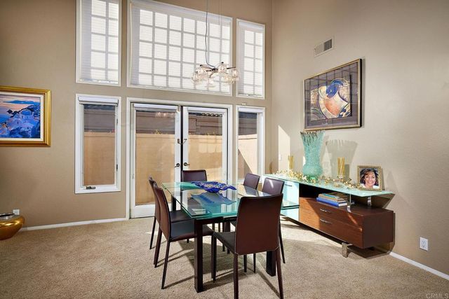 a spacious bedroom with a bed and window