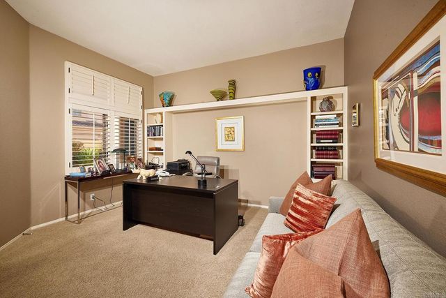 a spacious bathroom with a granite countertop tub sink and mirror
