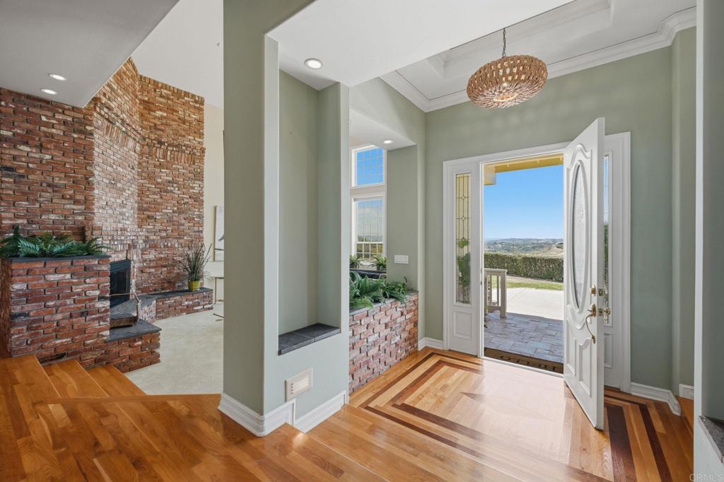 2292 Dos Lomas Fallbrook, CA 92028 - Photo 9 of 71 Grand entrance with custom inlaid decorative wood flooring