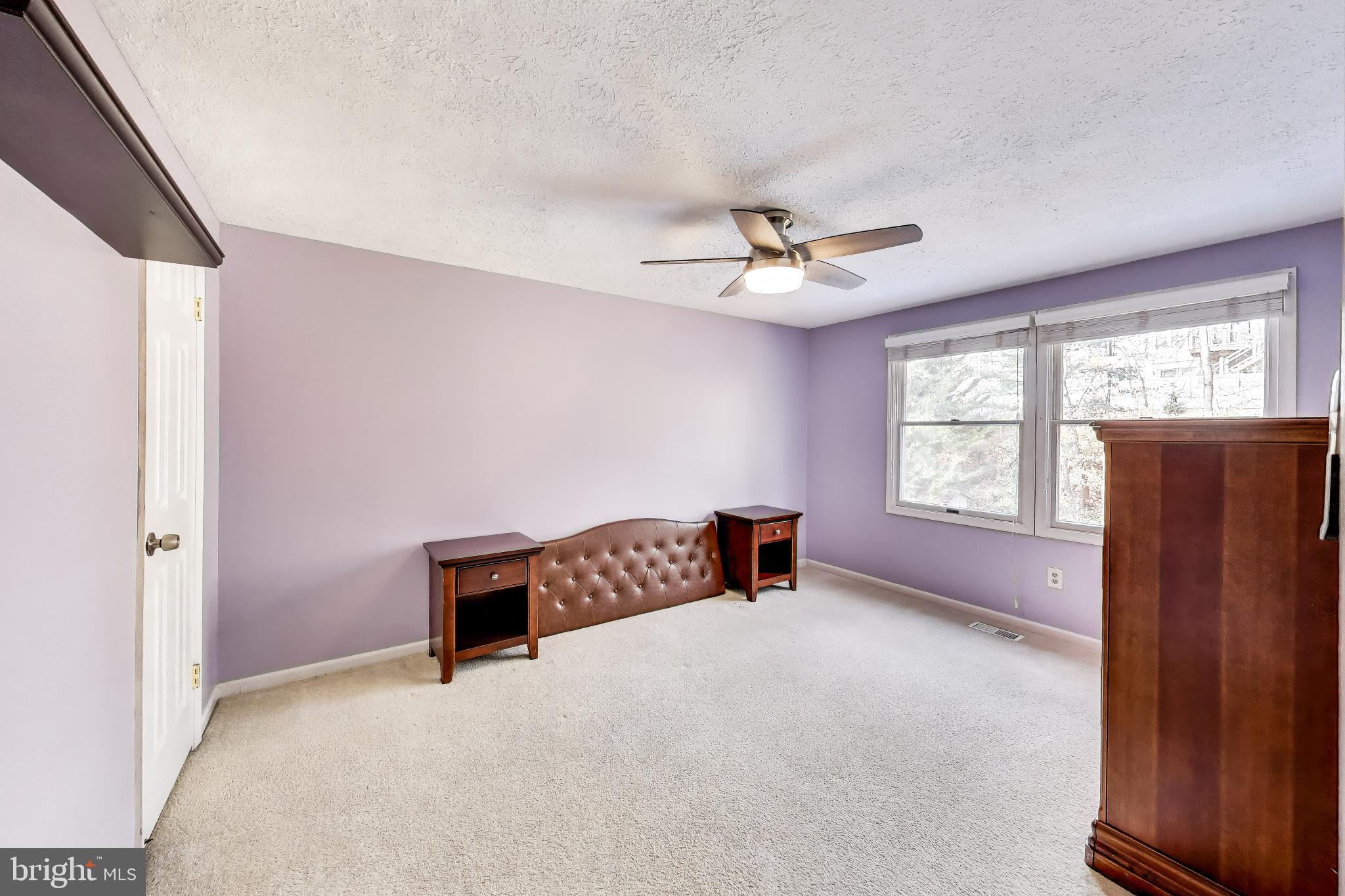 8404 Chillum Court Springfield, VA 22153 - Photo 38 of 56 Serene purple-hued bedroom retreat.