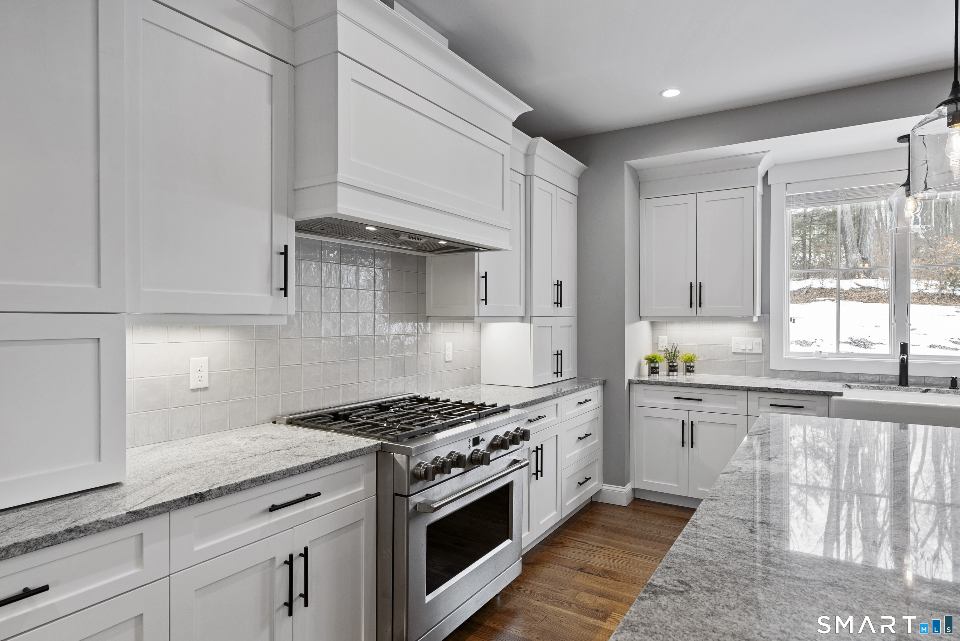 8 Gateshead Way Farmington, CT 06085 - Photo 14 of 39 a kitchen with granite countertop white cabinets and appliances