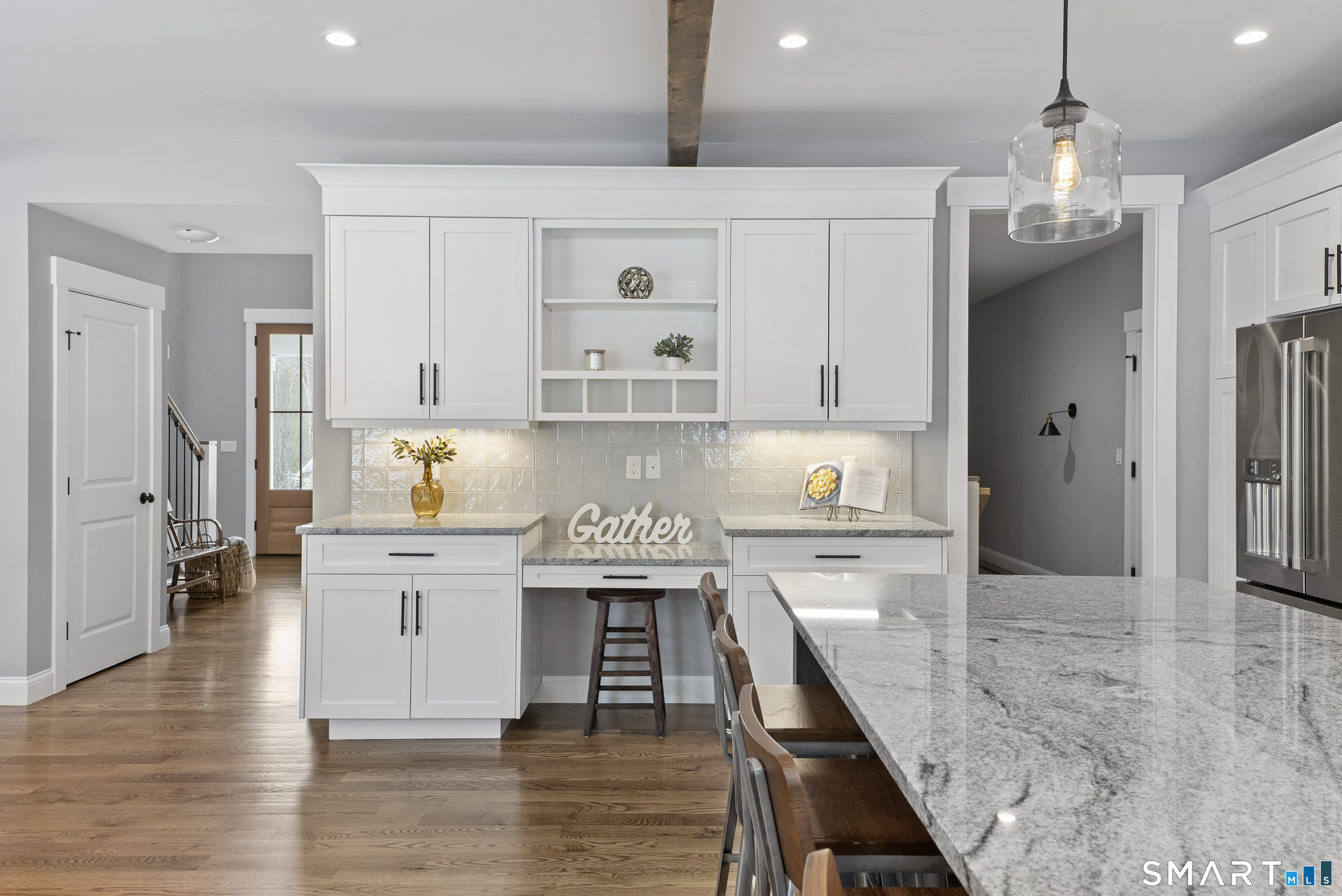 8 Gateshead Way Farmington, CT 06085 - Photo 15 of 39 a kitchen with stainless steel appliances granite countertop a lot of counter space and wooden floors