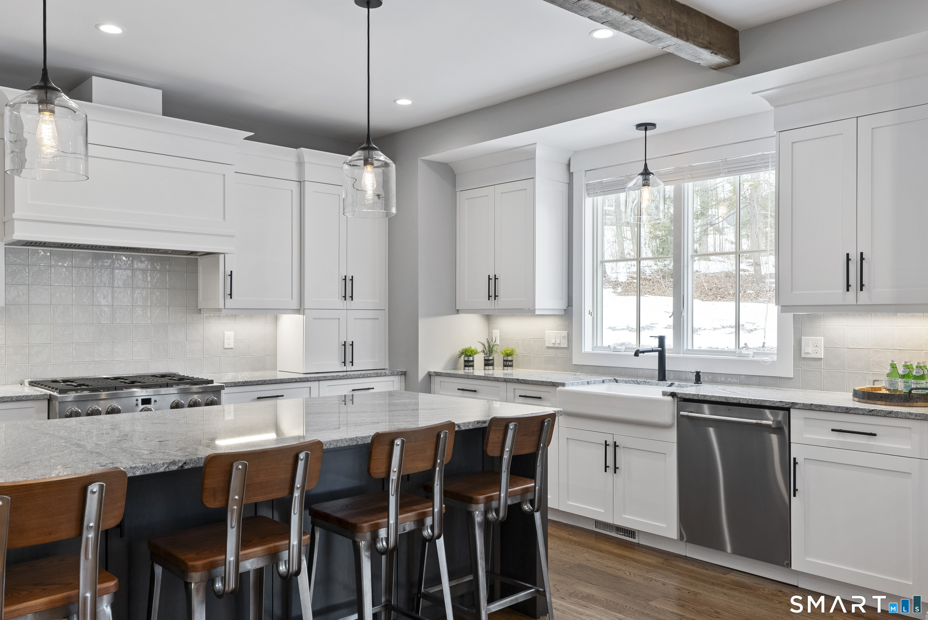 8 Gateshead Way Farmington, CT 06085 - Photo 17 of 39 a kitchen with stainless steel appliances granite countertop a table chairs sink and cabinets