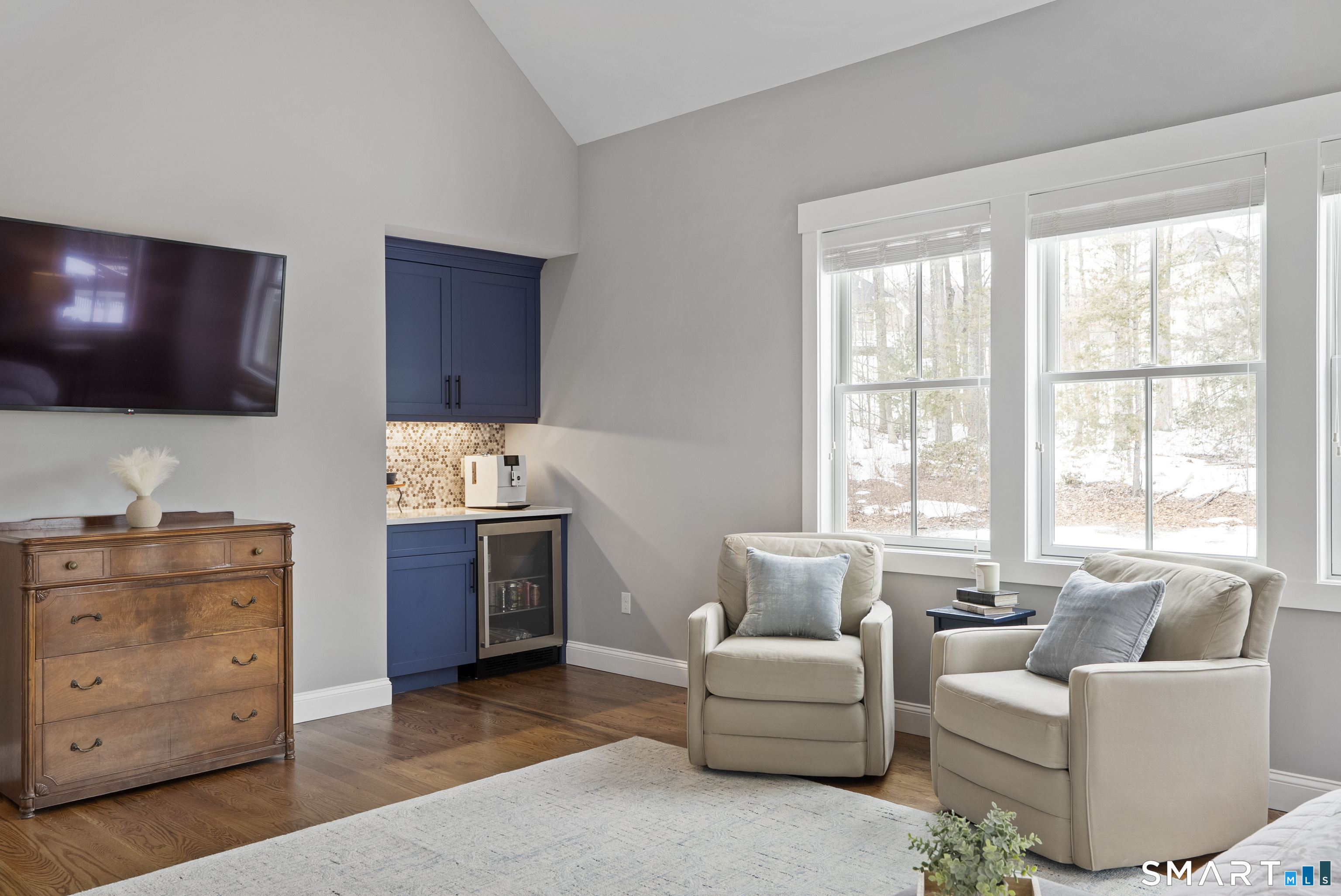 8 Gateshead Way Farmington, CT 06085 - Photo 32 of 39 a living room with furniture a flat screen tv and a window