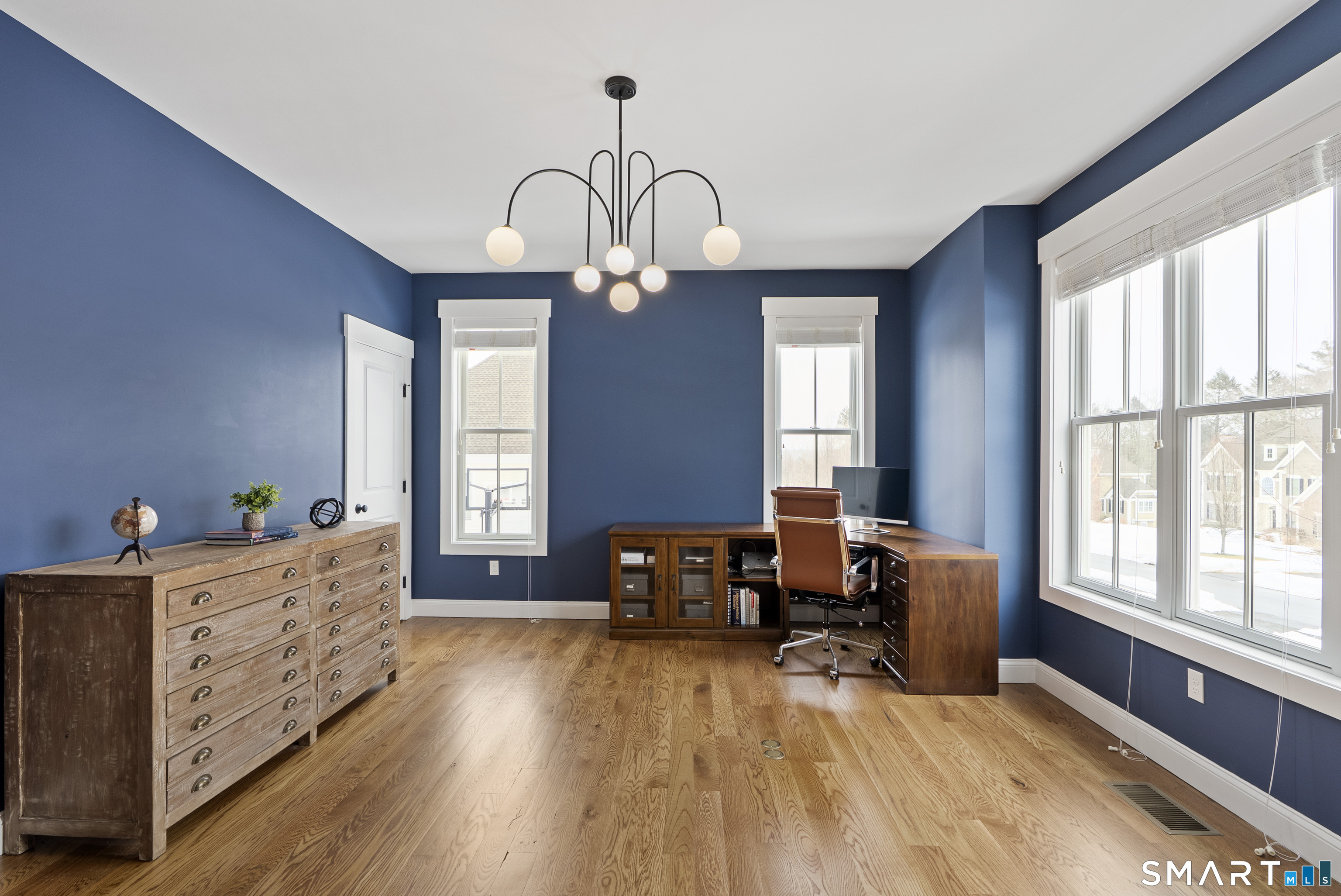 8 Gateshead Way Farmington, CT 06085 - Photo 36 of 39 a living room with furniture and a chandelier